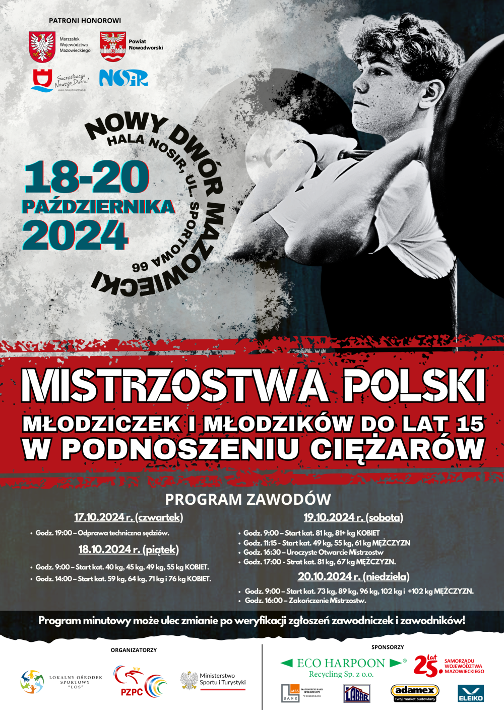 Chłopiec trzymający rękami sztangę z krążkami zarzuconą na barki.