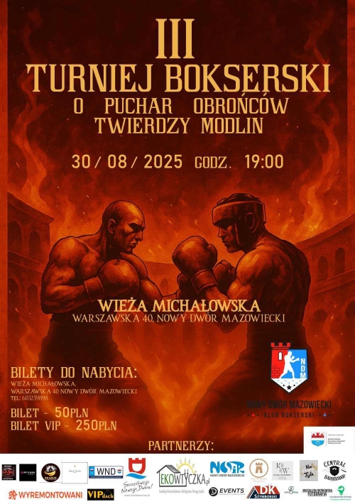 Dwóch mężczyzn stojących naprzeciwko siebie z uniesionymi rękami w rękawicach bokserskich.