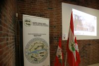 Rollup z nazwami, logotypami PTTK i Klubu Przewodników Bastion, flagi z logotypami PTTK, slajd Kasyna Oficerskiego na...