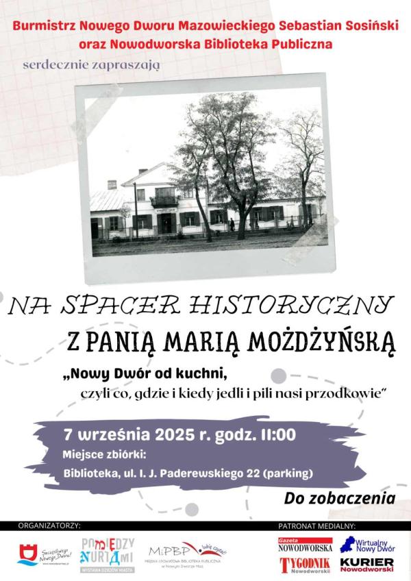 Graficzna informacja treści, za ogrodzeniem parku zabytkowy budynek ze skośnym dachem.