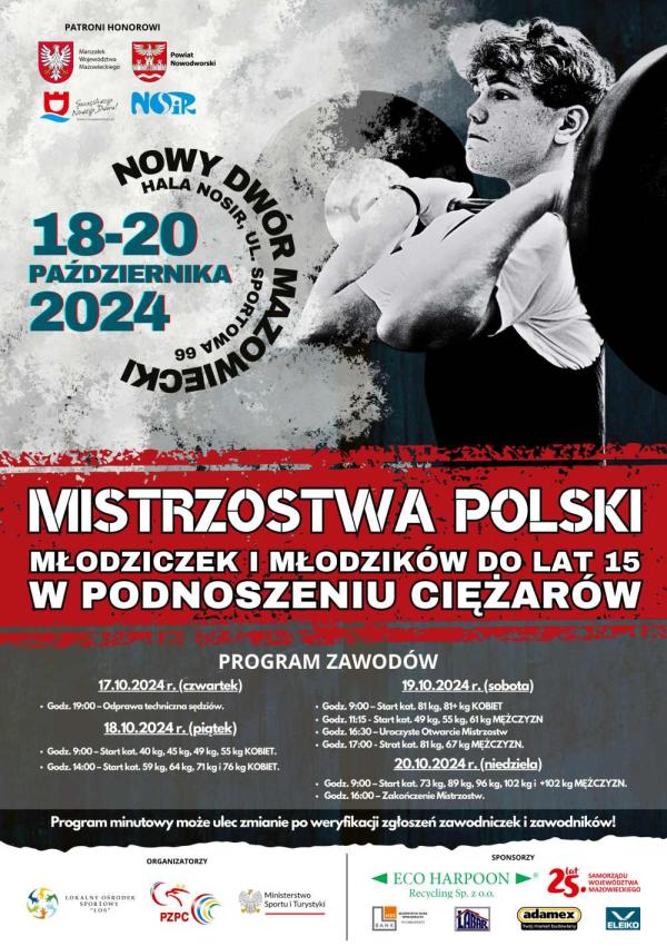 Chłopiec trzymający rękami sztangę z krążkami zarzuconą na barki.