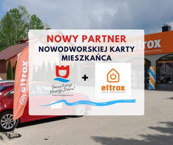 Budynek i flaga z napisem eltrox.