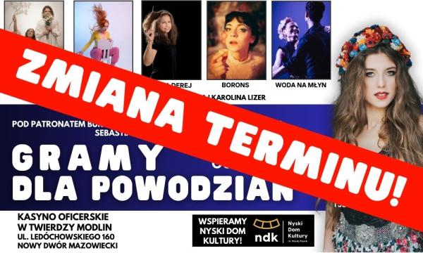 Kobieta w długich włosach z wiankiem kolorowych kwiatów na głowie.